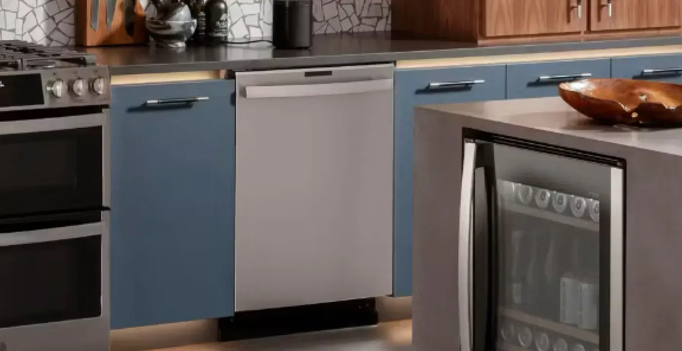 dishwasher and blue cabinets